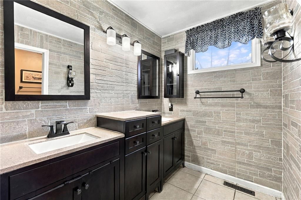 Tile floors, walk-in shower and tiled shower at 205 NW 101st Place, Kansas City, MO 64155