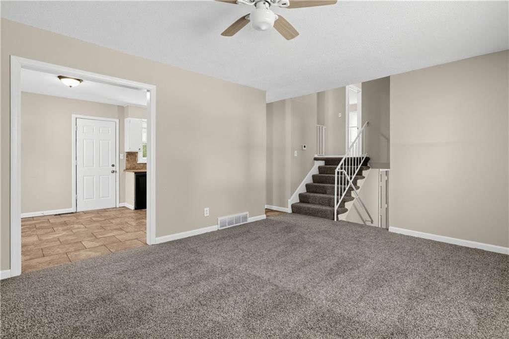 Staircase, iron stair railing and white trim at 11727 FREMONT Avenue, Kansas City, MO 64134