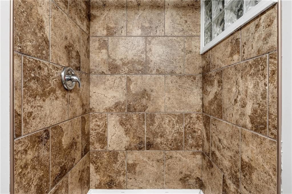 Tiled shower at 11727 FREMONT Avenue, Kansas City, MO 64134