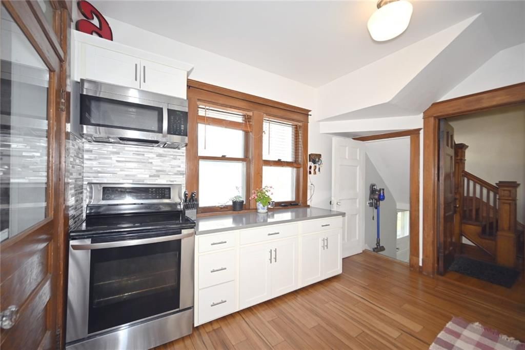 Photo 18: white kitchen cabinets, 4222 Terrace Street, Kansas City, MO 64111