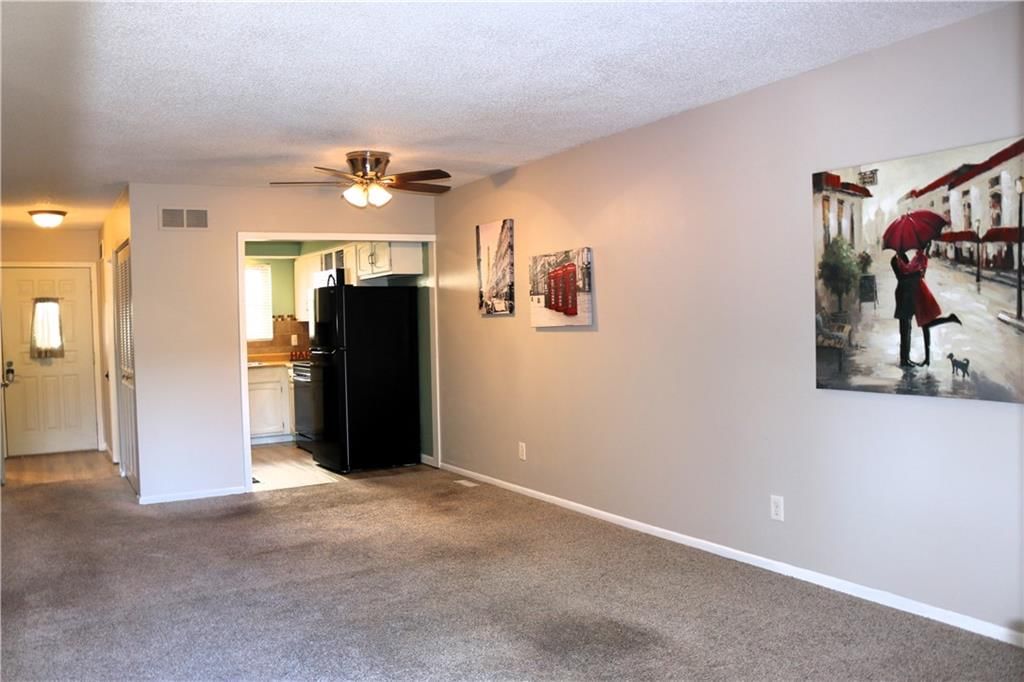 Fireplace and open floor plan at 10252 W 96TH Terrace #146, Overland Park, KS 66212