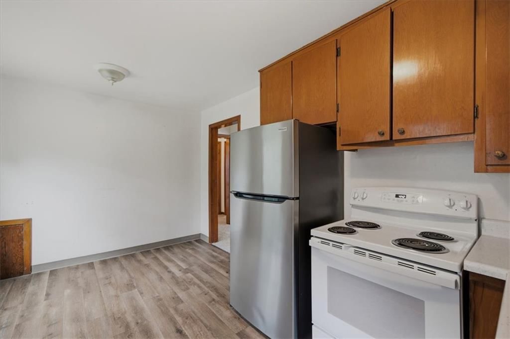 Stainless steel appliances and electric range at 909 E 100th Terrace, Kansas City, MO 64131