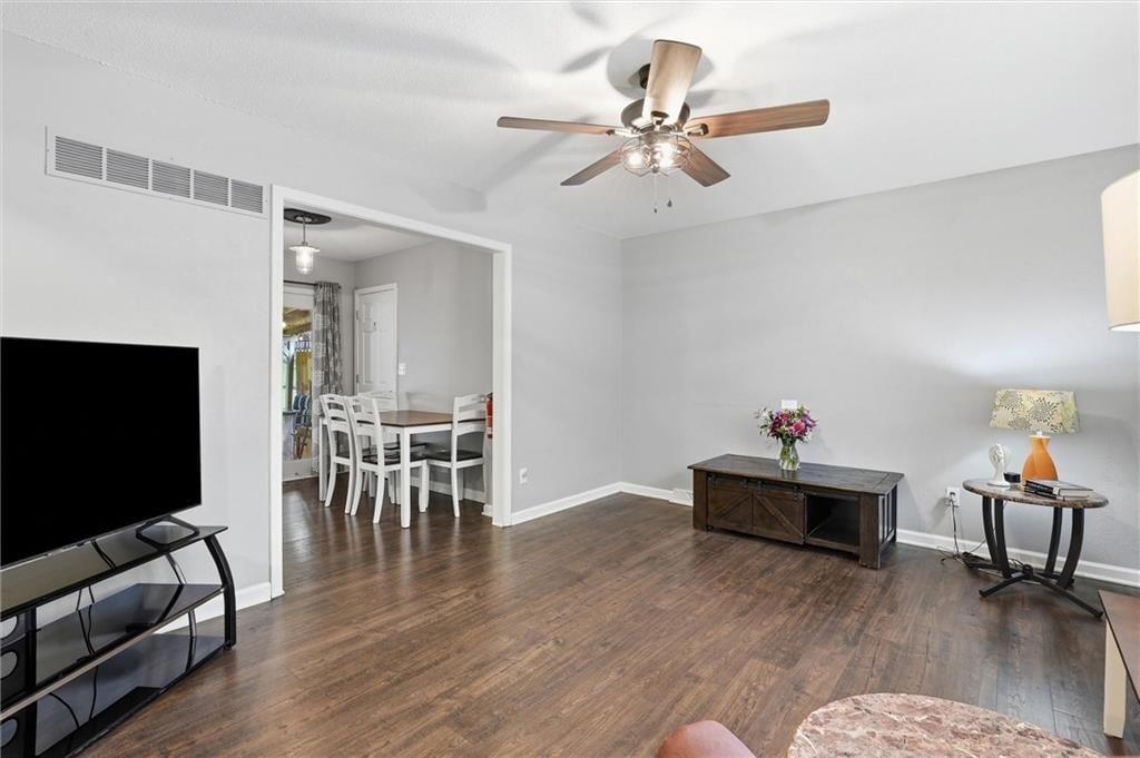 Hardwood floors, white trim and gray walls at 16317 E 34th Street S, Independence, MO 64055