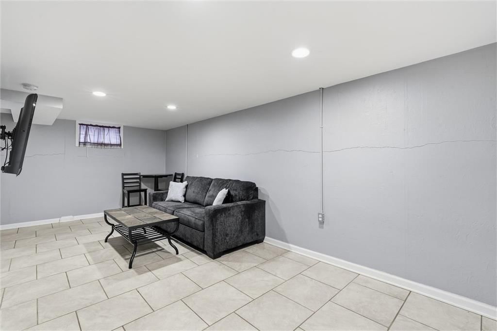 Finished basement, tile floors and recessed lighting at 16317 E 34th Street S, Independence, MO 64055