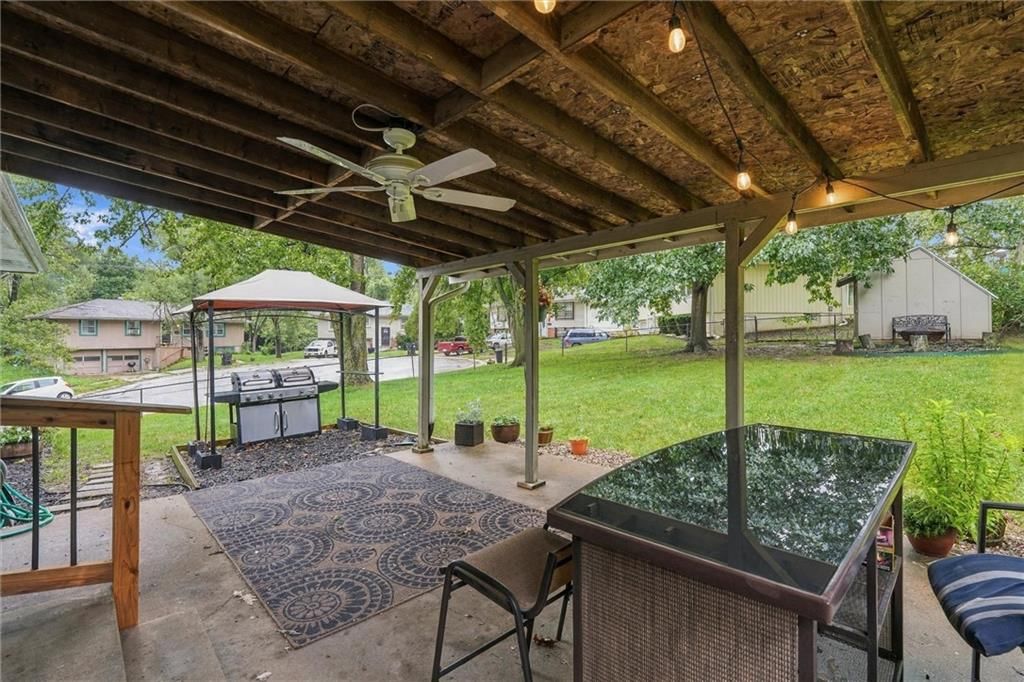 Covered patio and concrete patio at 16317 E 34th Street S, Independence, MO 64055