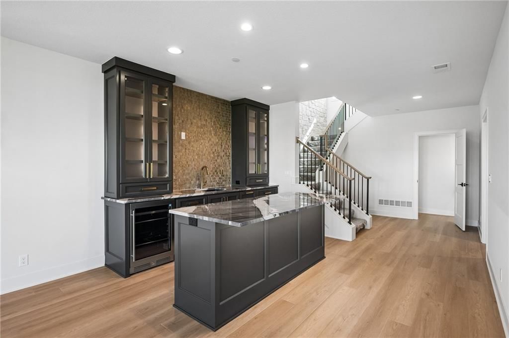 Finished basement and wet bar at 13725 Pembroke Lane, Leawood, KS 66224