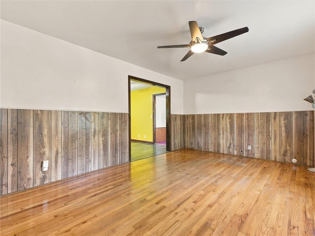 Hardwood floors and shiplap / paneling at 500 S Hunter Street, Independence, MO 64050