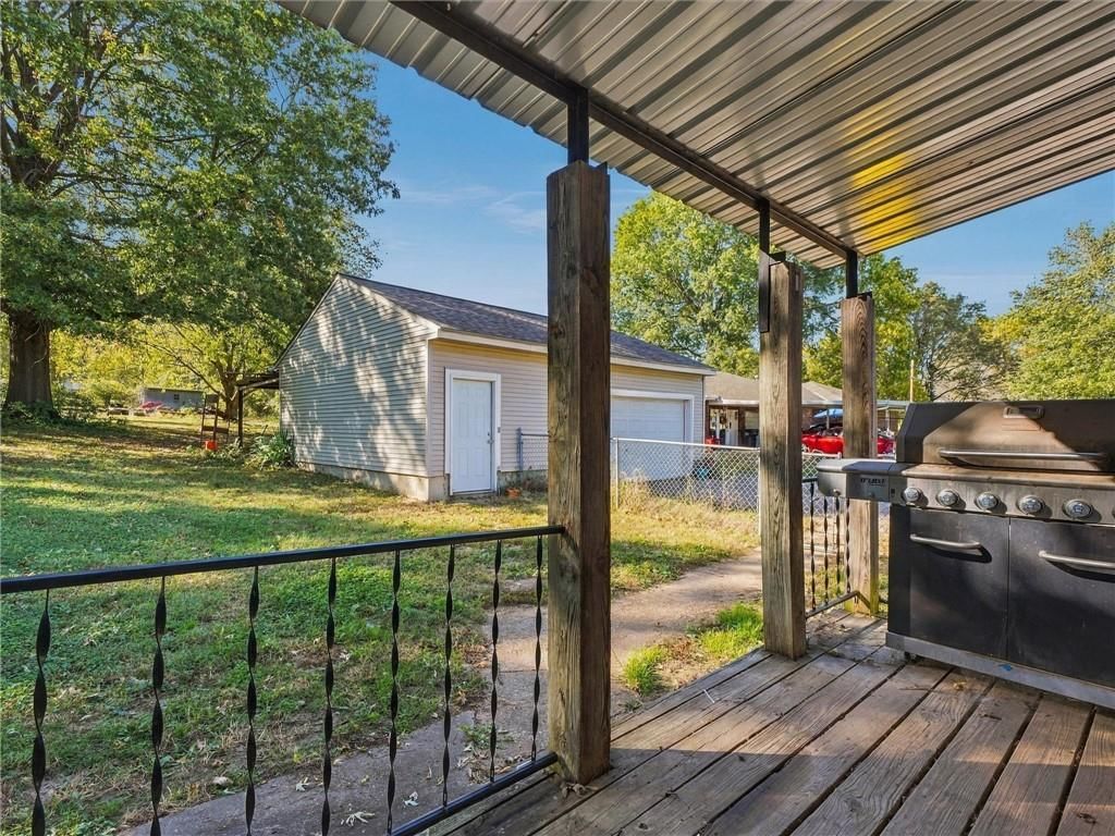 Big backyard, mature trees and fire pit at 500 S Hunter Street, Independence, MO 64050