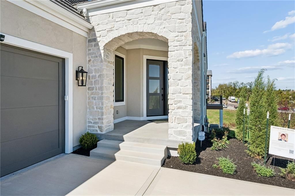 Covered front porch at 13727 Pembroke Lane, Leawood, KS 66224