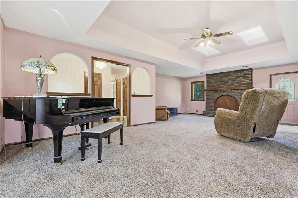Fireplace, tray ceiling and brick fireplace at 15932 E 41st Street S, Independence, MO 64055