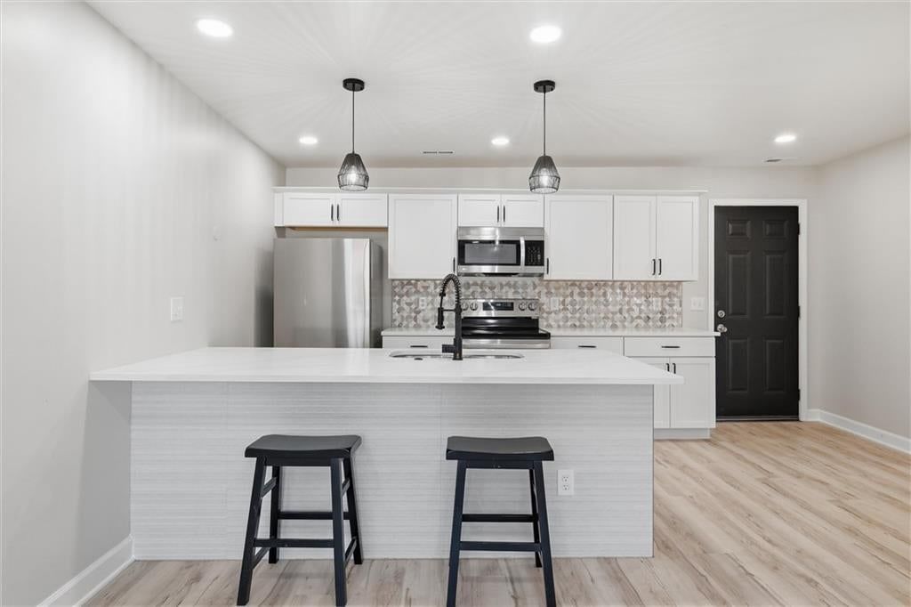 Photo 8: white kitchen cabinets, 1017 S Brockway Street, Olathe, KS 66061