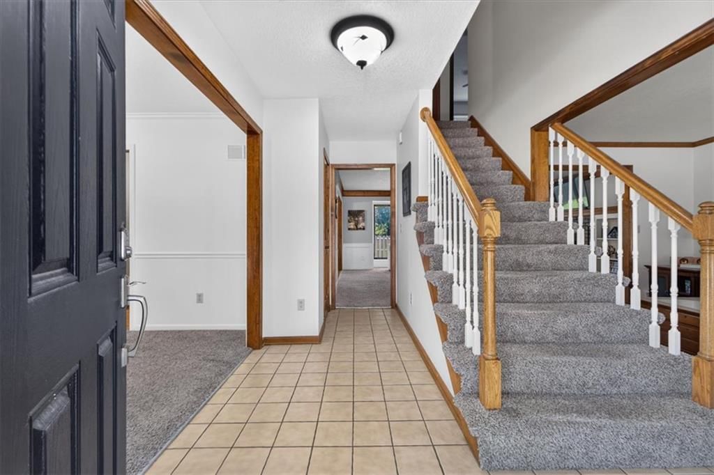 Staircase and wood stair railing at 713 NW Eagle Ridge Circle, Lee's Summit, MO 64081