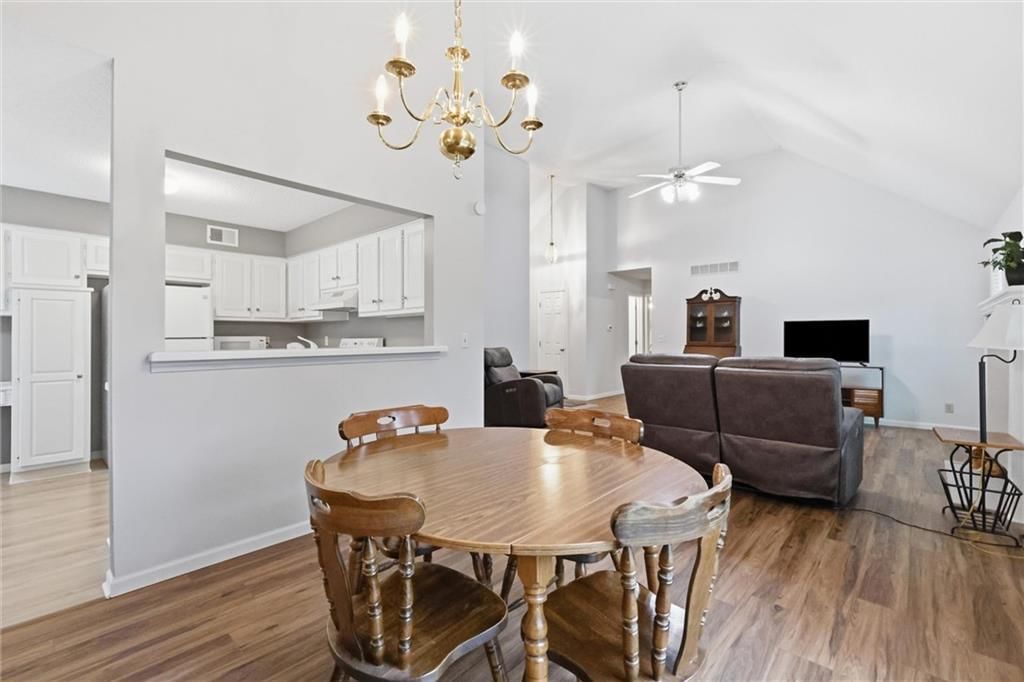 Open floor plan, chandelier and breakfast nook at 15724 Travis Street, Overland Park, KS 66223