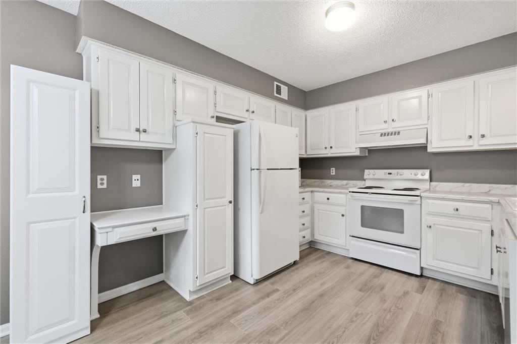 Photo 9: white kitchen cabinets, 15724 Travis Street, Overland Park, KS 66223