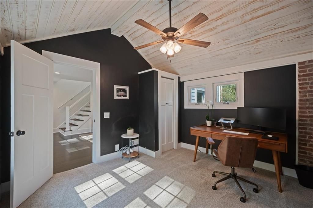 Home office, shiplap / paneling and black hardware at 8639 Maiden Lane, Kansas City, MO 64114