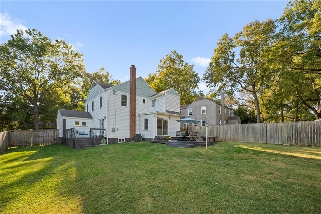 Deck, big backyard and fenced yard at 8639 Maiden Lane, Kansas City, MO 64114