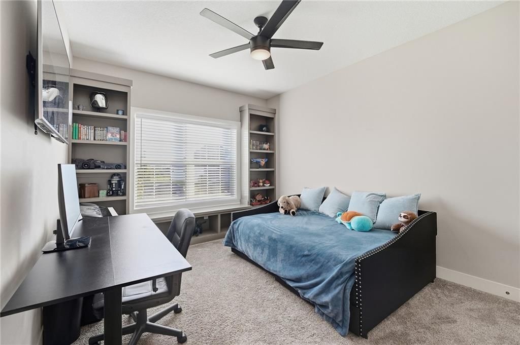 Main-floor primary bedroom and tray ceiling at 4372 Aspen Drive, Basehor, KS 66007
