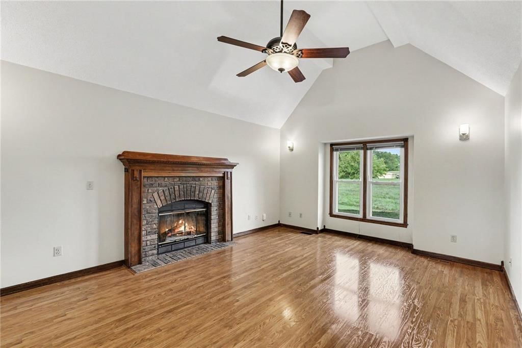 Tall ceilings, fireplace and hardwood floors at 26503 283rd Street, Harrisonville, MO 64701