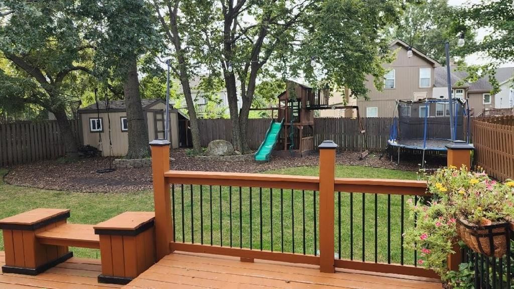 Deck, big backyard and fenced yard at 541 E Mockingbird Street, Gardner, KS 66030