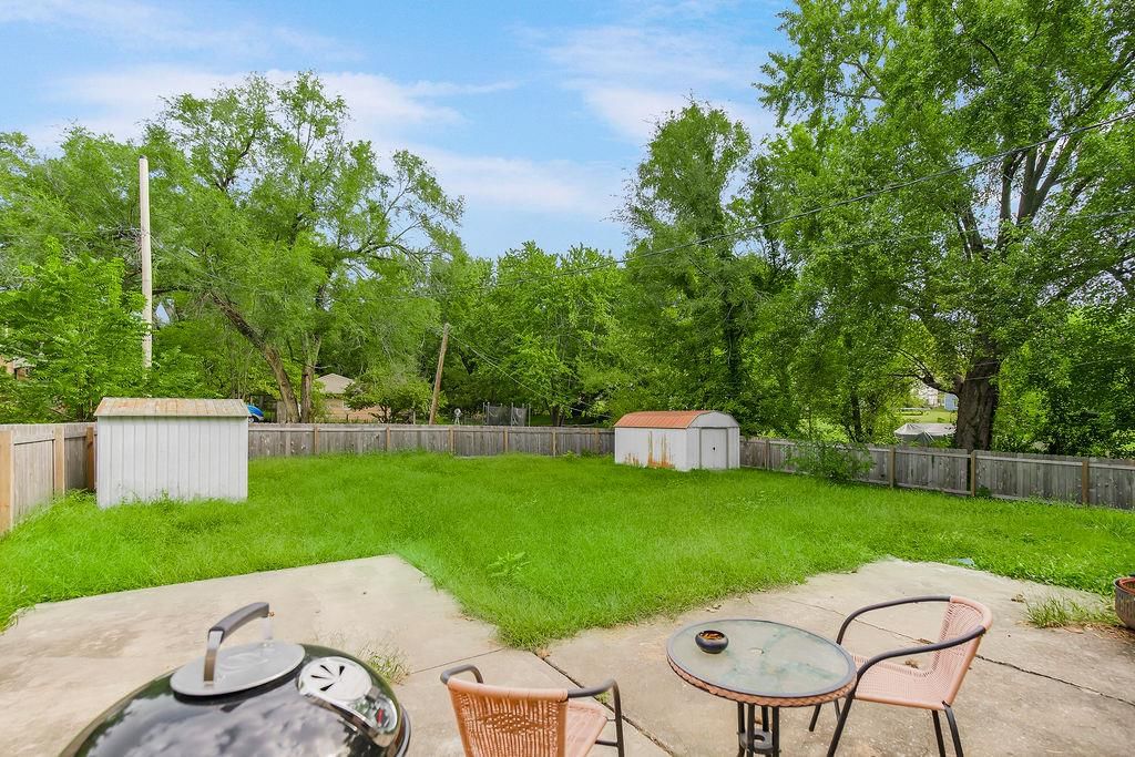 Photo 5: fenced yard, 11604 E 55th Street, Raytown, MO 64133