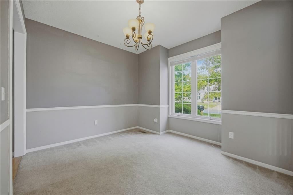 Wainscoting or board and batten and carpet at 361 W Westhoff Place, Gardner, KS 66030