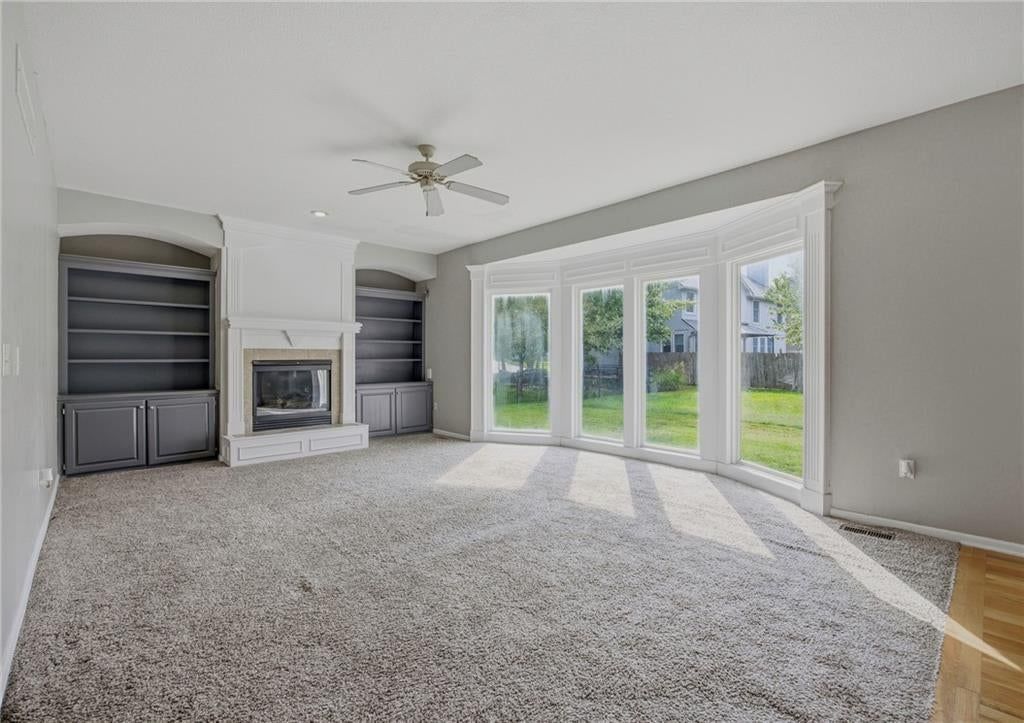 Fireplace and wall of windows at 361 W Westhoff Place, Gardner, KS 66030