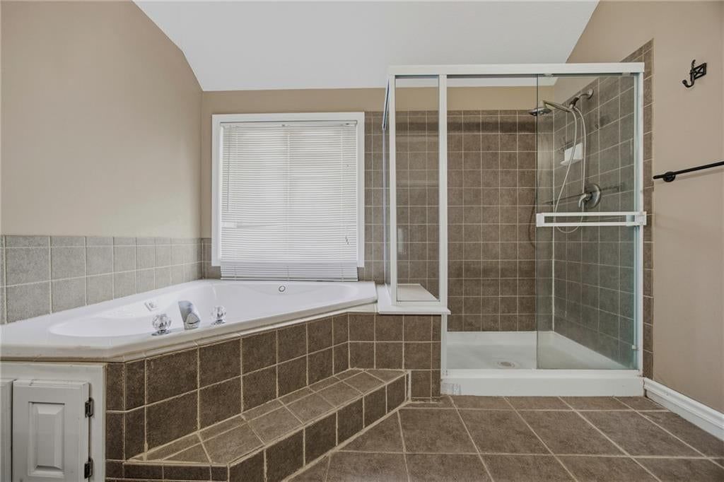 Walk-in shower and tiled shower at 361 W Westhoff Place, Gardner, KS 66030
