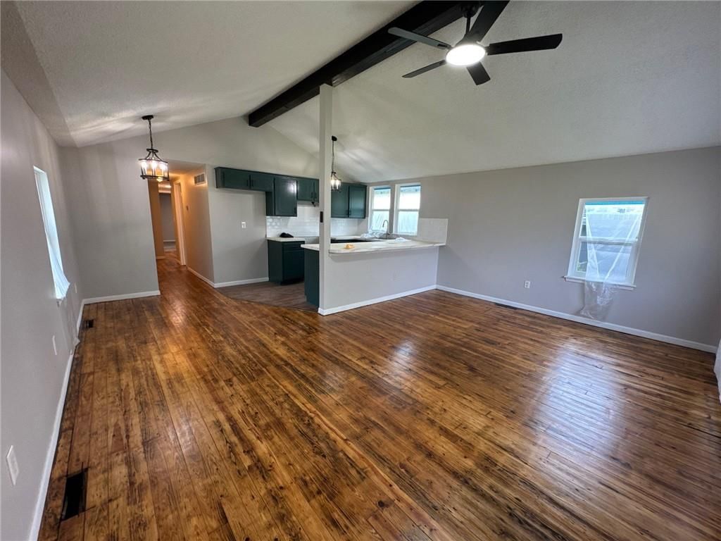 Open floor plan, hardwood floors and tray ceiling at 1003 E 83RD Terrace, Kansas City, MO 64131