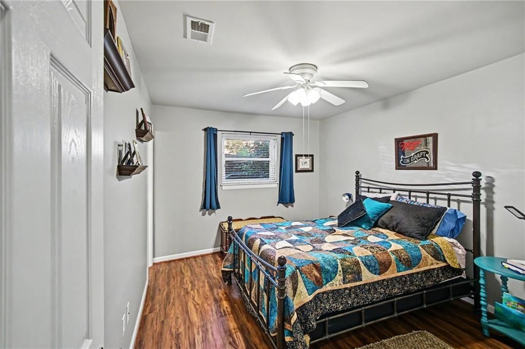 Main-floor primary bedroom at 5004 Baltimore Avenue #103, Kansas City, MO 64112