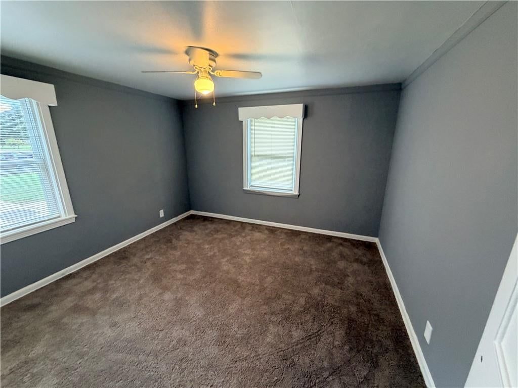 Main-floor primary bedroom and carpet at 3004 E Meyer Boulevard, Kansas City, MO 66418
