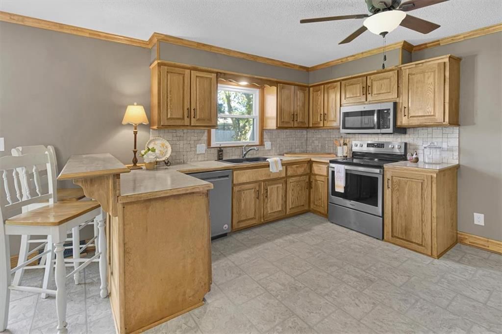 Tile floors and breakfast nook at 112 W 8th Street, Kearney, MO 64060