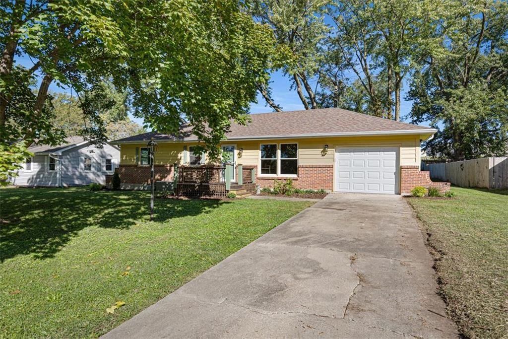Main-floor primary bedroom at 112 W 8th Street, Kearney, MO 64060