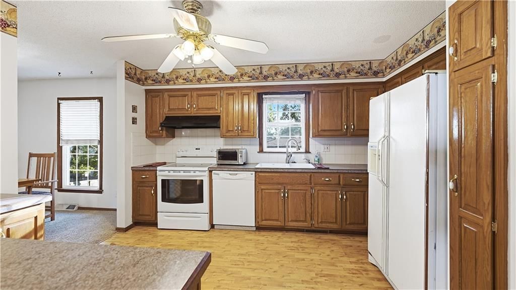 Kitchen open to the living area at 9146 Antioch Road, Overland Park, KS 66212