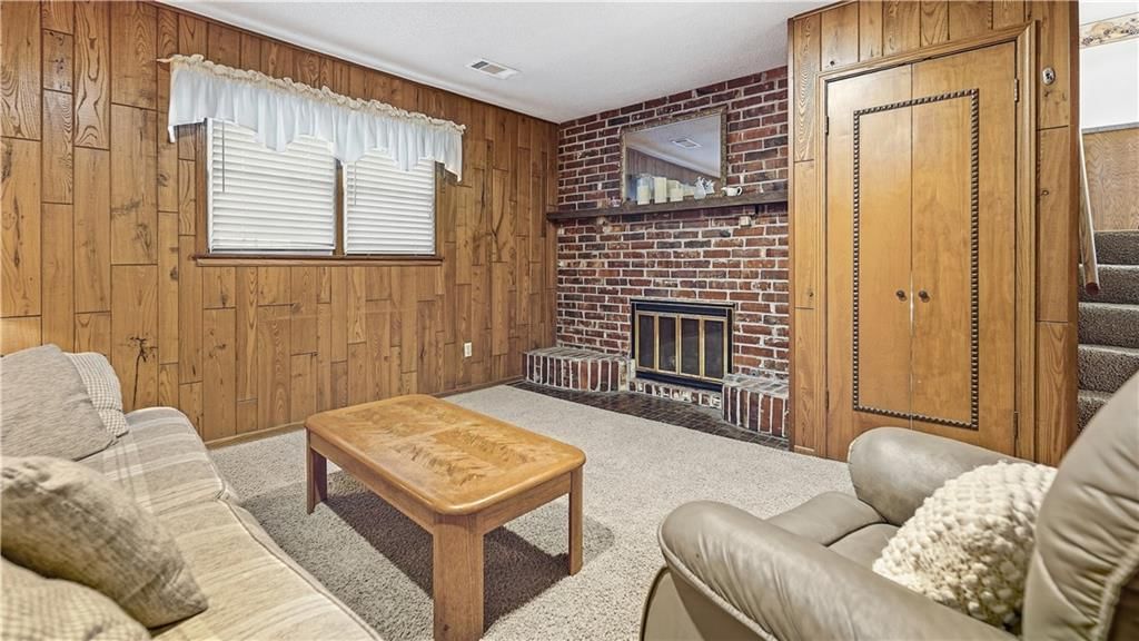 Finished basement, fireplace and exposed brick wall at 9146 Antioch Road, Overland Park, KS 66212