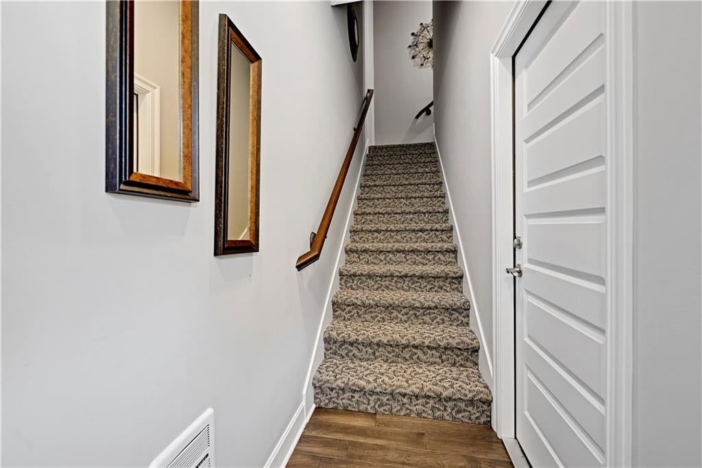 Hardwood floors, staircase and wood stair railing at 16001 Granada Street #230, Stilwell, KS 66085