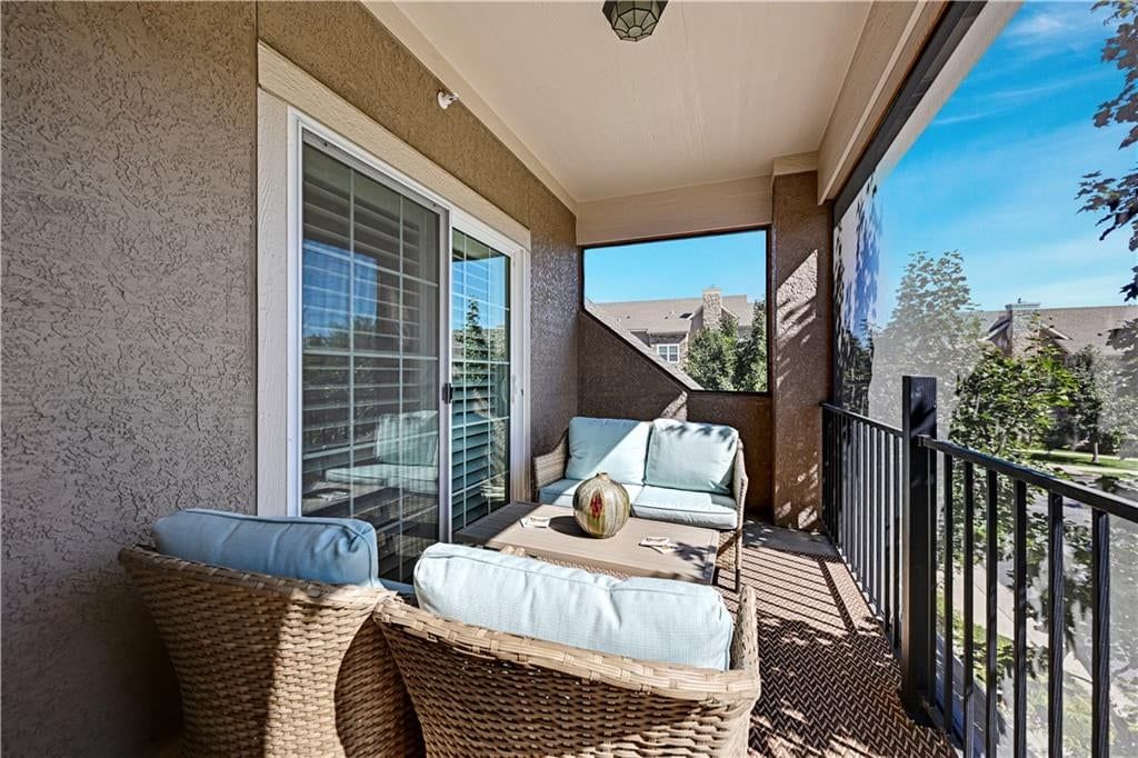 Screened porch and covered patio at 16001 Granada Street #230, Stilwell, KS 66085