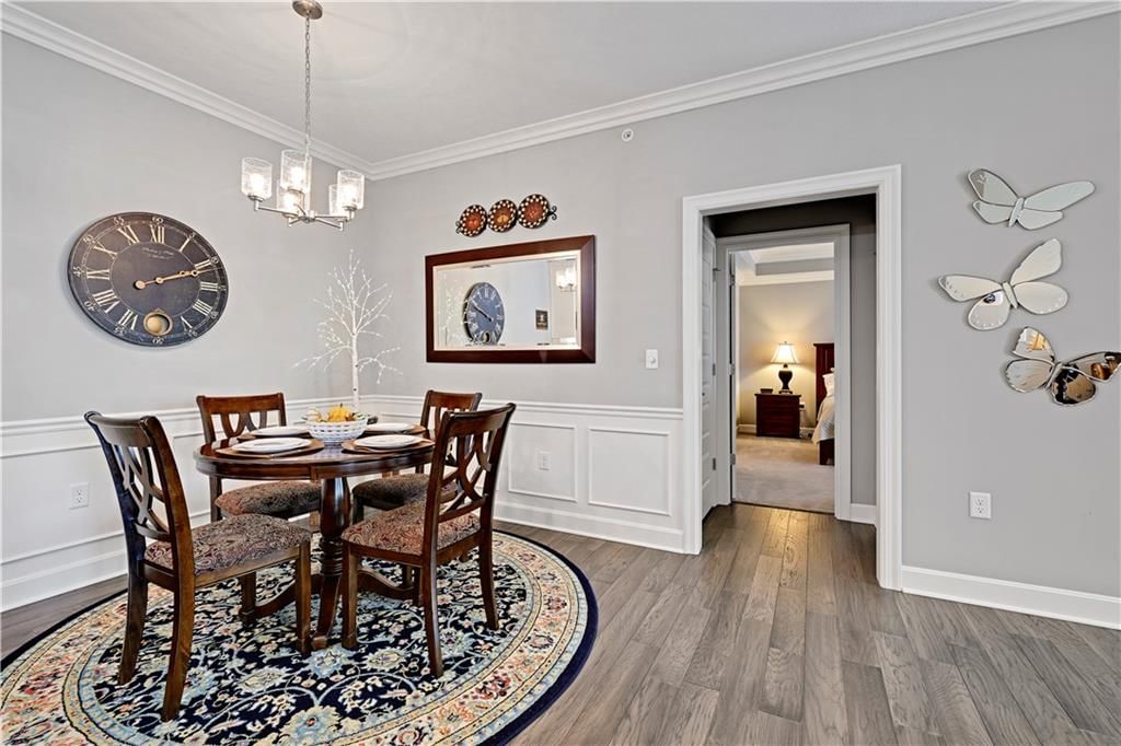 Kitchen island, statement lighting and wainscoting or board and batten at 16001 Granada Street #230, Stilwell, KS 66085