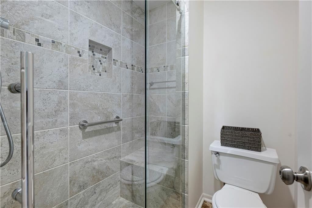 Walk-in shower, tiled shower and frameless glass shower at 12432 Perry Street, Overland Park, KS 66213