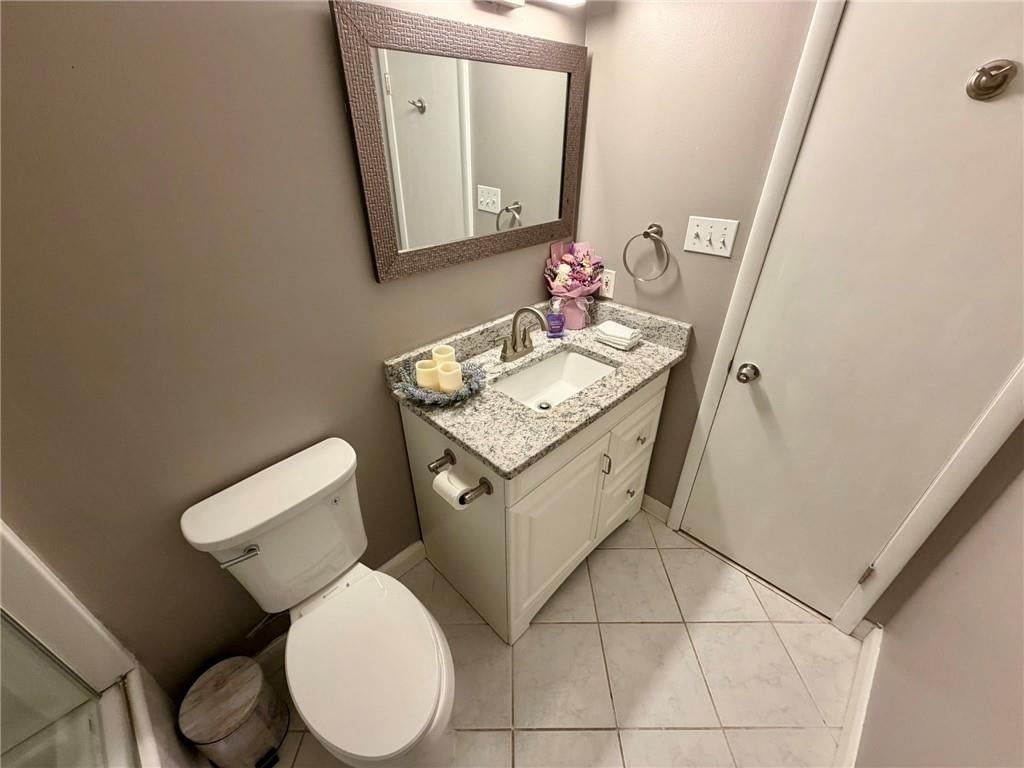 Tile floors and tiled shower at 8842 Foster Lane, Overland Park, KS 66212