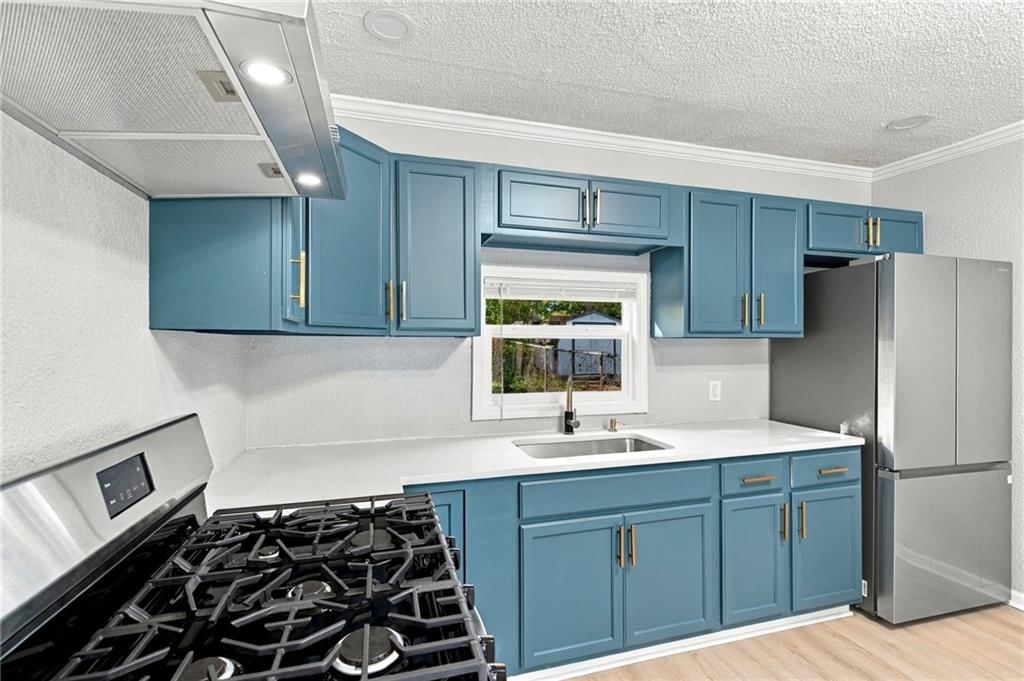 Updated kitchen, stainless steel appliances and gas range at 15023 E Truman Road, Independence, MO 64050