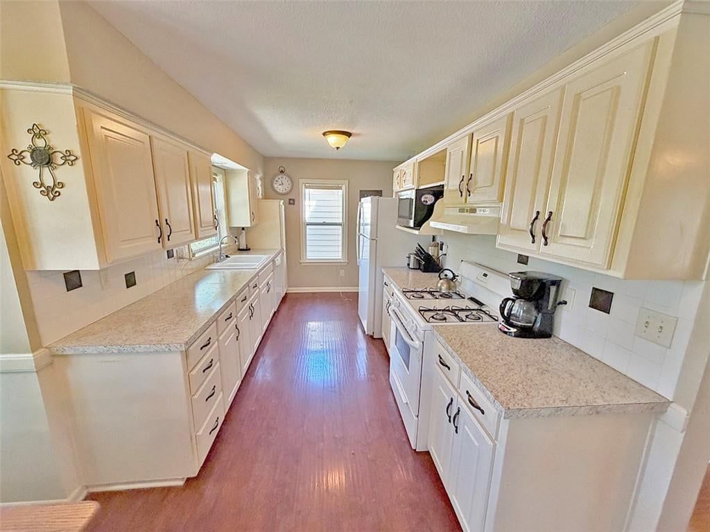White kitchen and black hardware at 3690 S Crysler Avenue, Independence, MO 64055