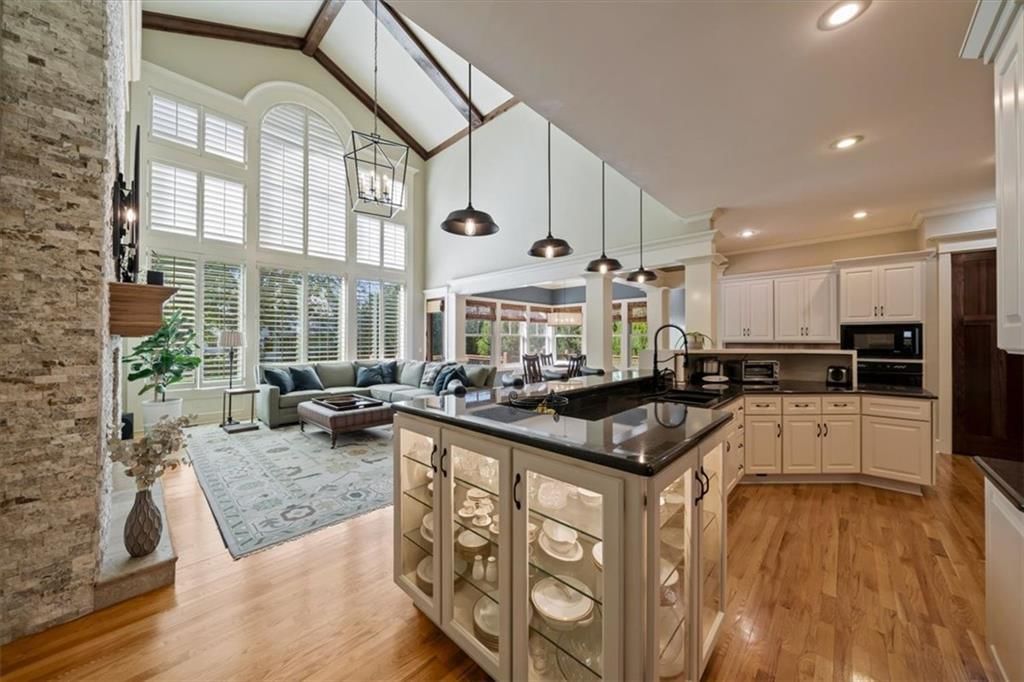 Kitchen island and statement lighting at 14204 Bluejacket Street, Overland Park, KS 66221