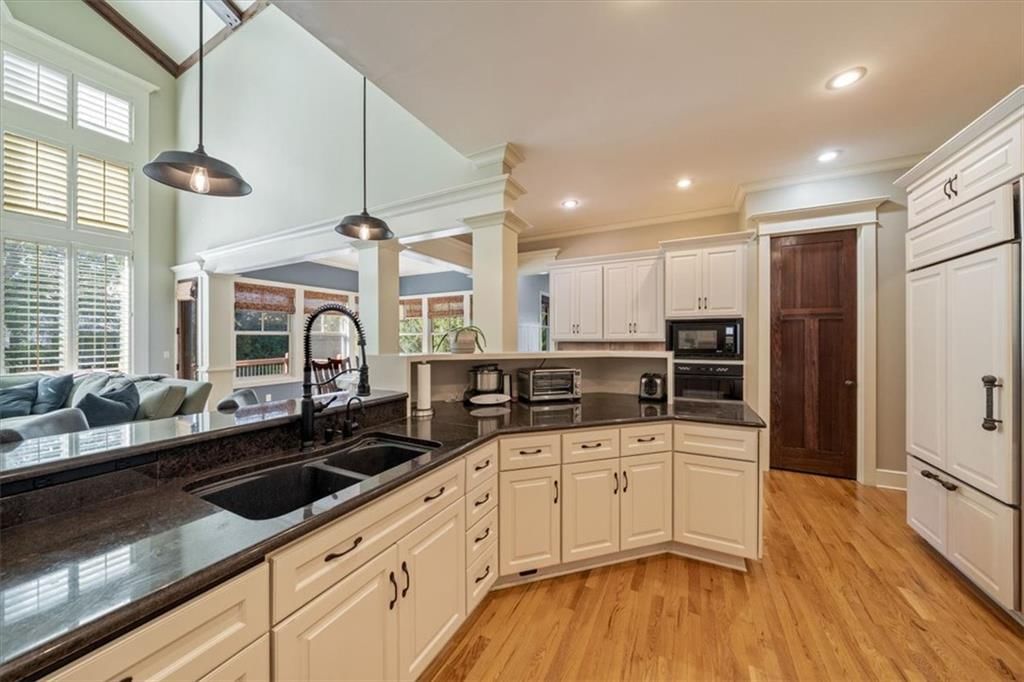 Tall ceilings, open floor plan and floor-to-ceiling windows at 14204 Bluejacket Street, Overland Park, KS 66221
