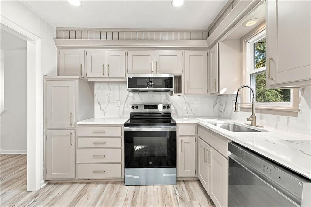 Photo 13: stainless steel appliances, 8915 E 57TH Street, Raytown, MO 64133
