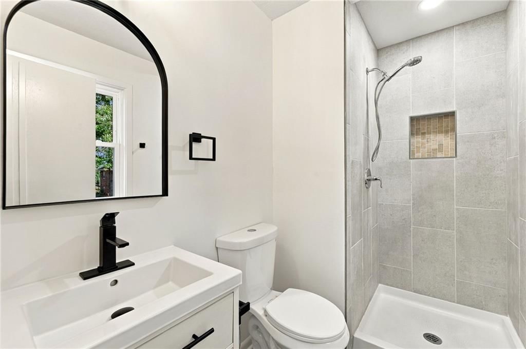 Walk-in shower and tiled shower at 8915 E 57TH Street, Raytown, MO 64133