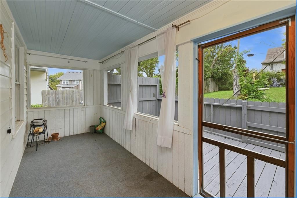 Screened porch at 124 S Myrtle Street, Excelsior Springs, MO 64024