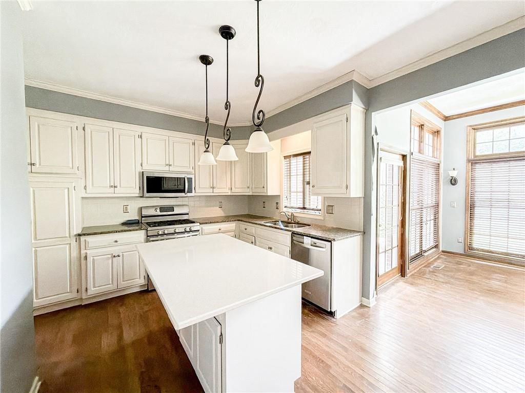 Kitchen open to the living area at 6836 Glenwood Street, Overland Park, KS 66204