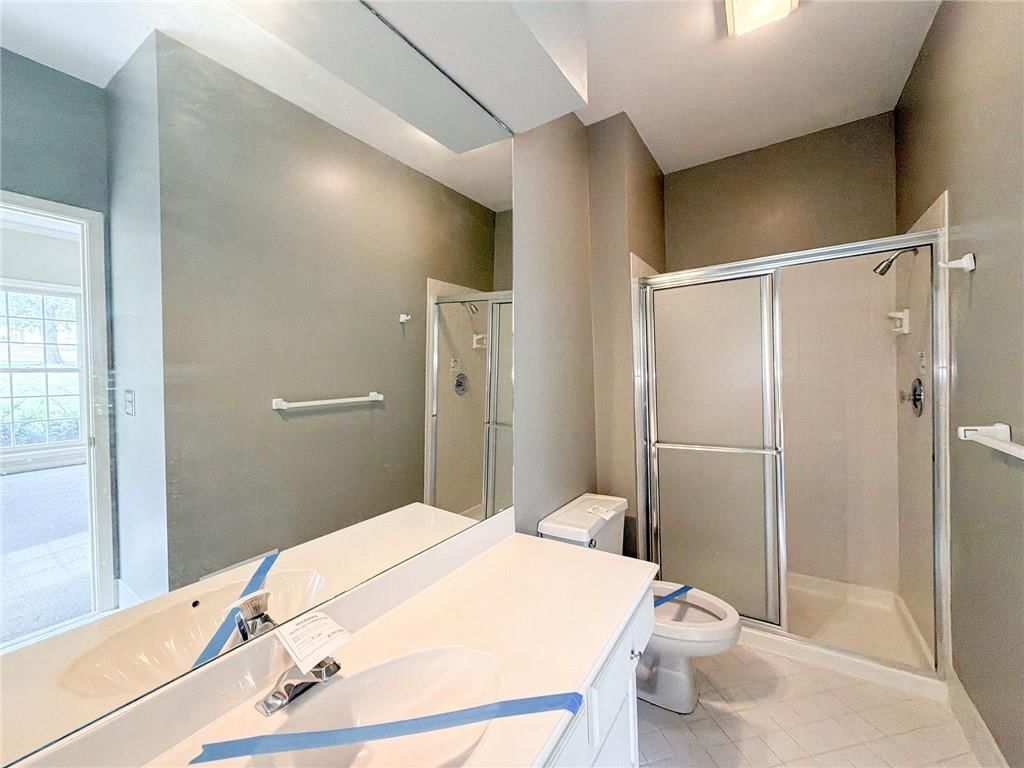 Walk-in shower and tiled shower at 6836 Glenwood Street, Overland Park, KS 66204