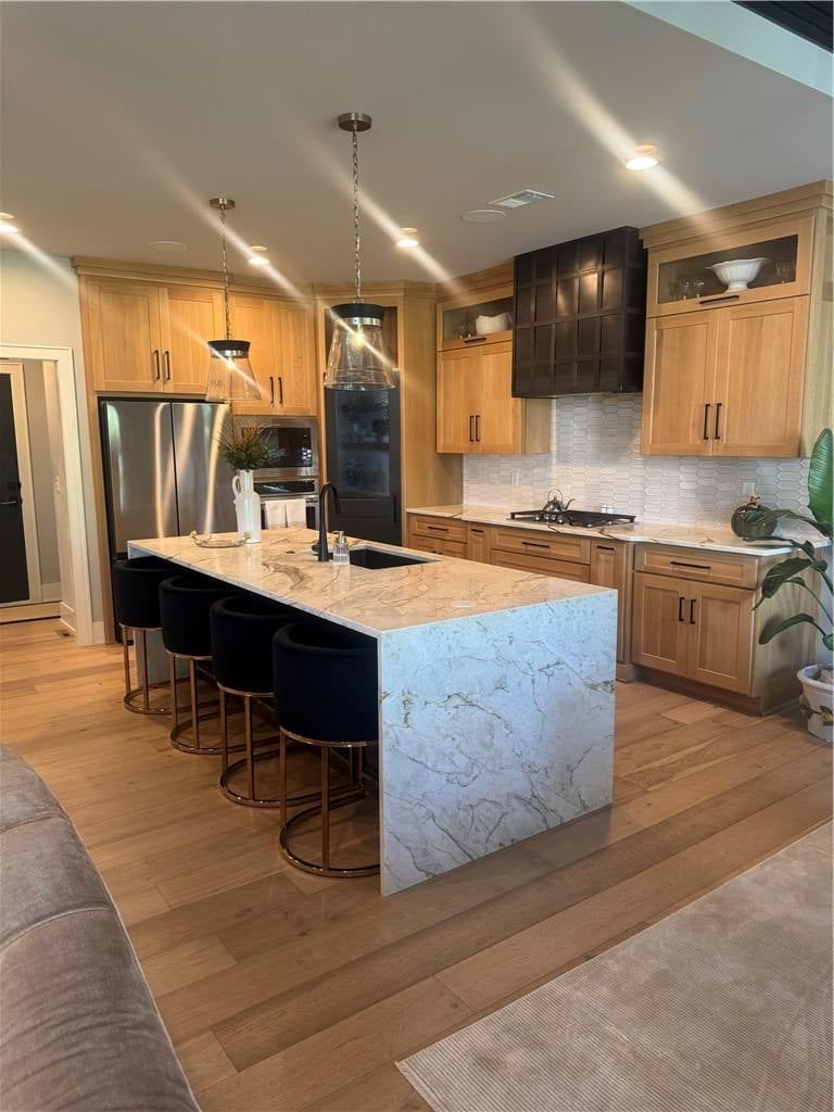 Kitchen island, waterfall island and breakfast nook at 540 South Shore Drive, Lake Winnebago, MO 64034