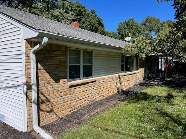 Mature trees and flat lot at 2504 Westport Road, Independence, MO 64052